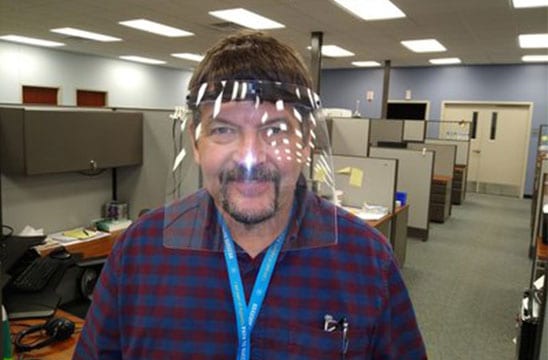 Agilent's Kevin Kennedy wears a face shield that was 3D-printed and assembled at the Agilent Ankeny facility.