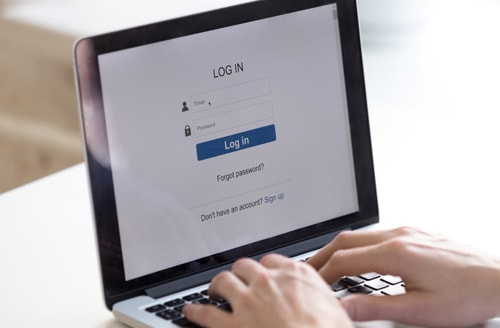 stock photo of a laptop that shows a generic login form on it