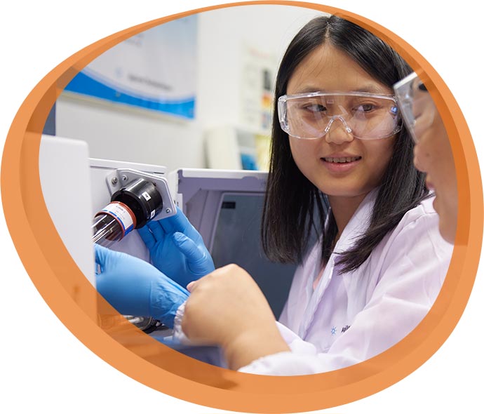 scientist working on a UV-Vis system