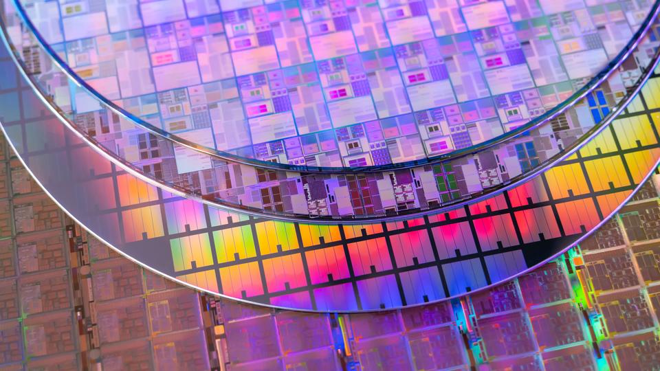 A large silicon wafer showing the printed circuits of a large number of processors