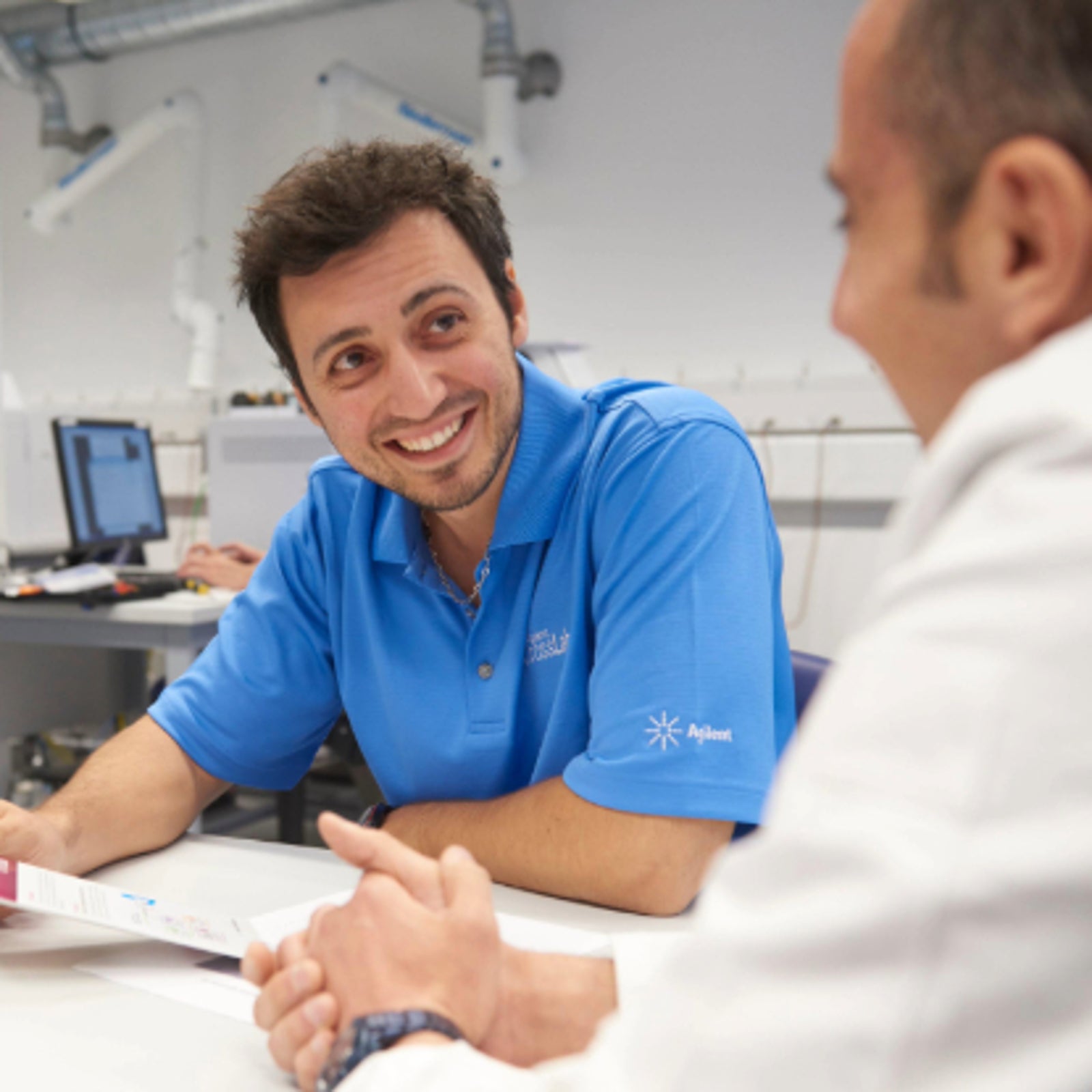 Customer and Agilent rep at a table