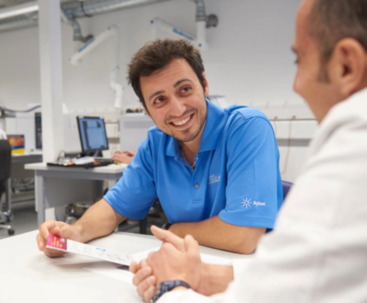 Customer and Agilent rep at a table