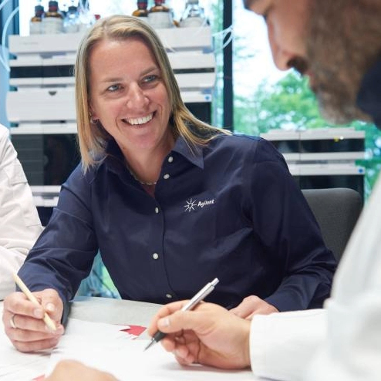 CrossLab team with a customer