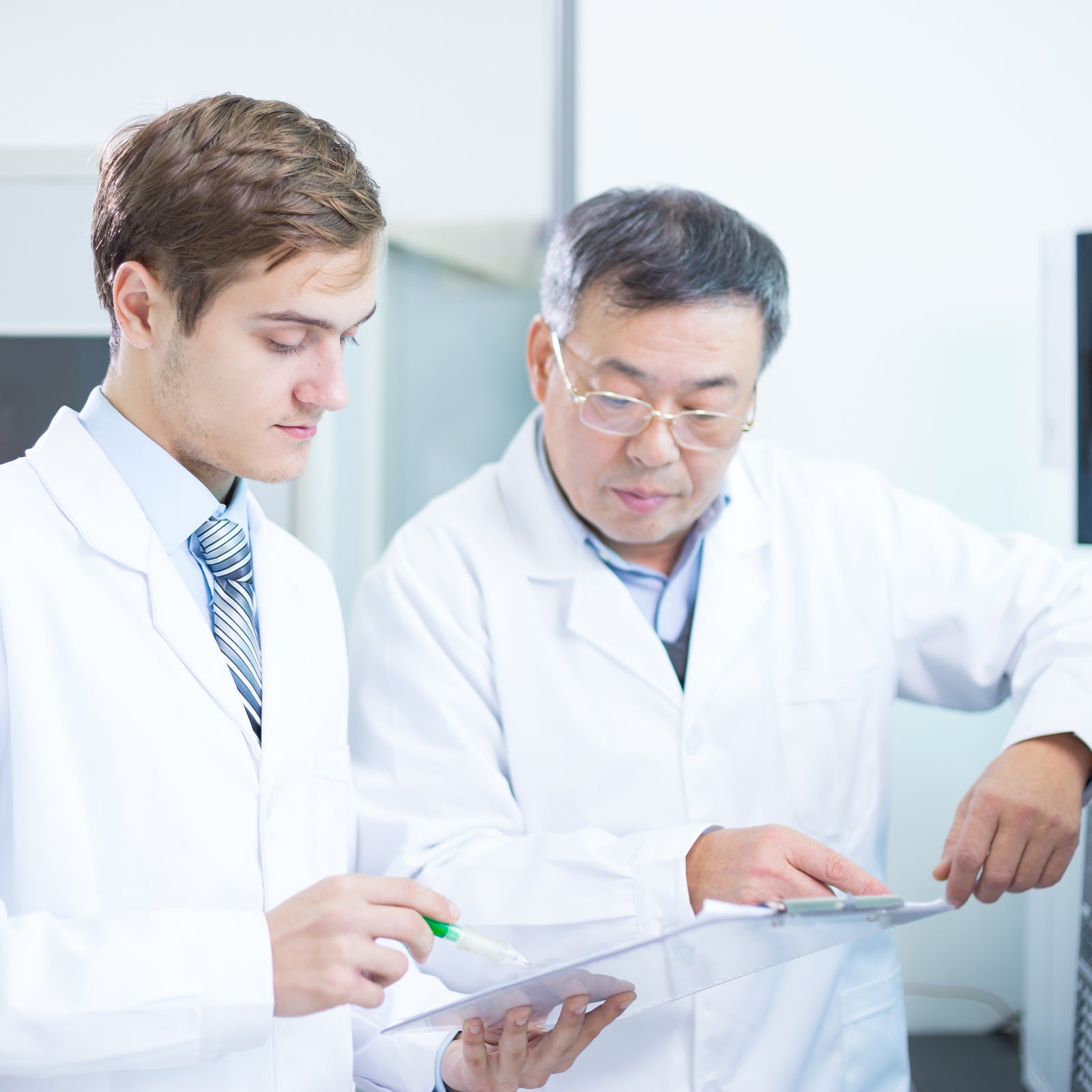 people analysis chemical experimental data with tablet