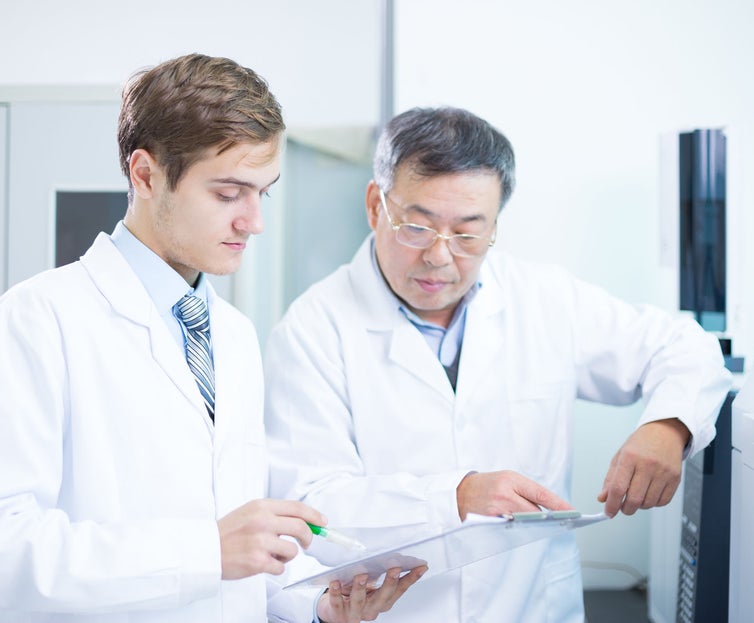 people analysis chemical experimental data with tablet